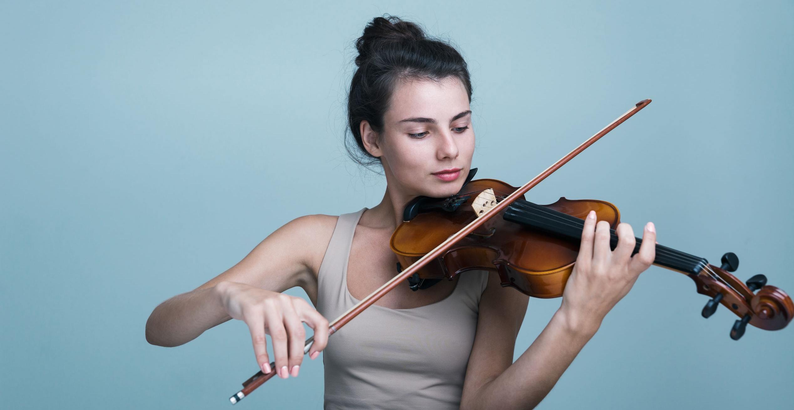 A pic of a violinist, who'd feel like an imposter if she had teammates.