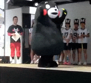 This is a gif of someone dressed up as a cartoon bear and trying to jump rope.