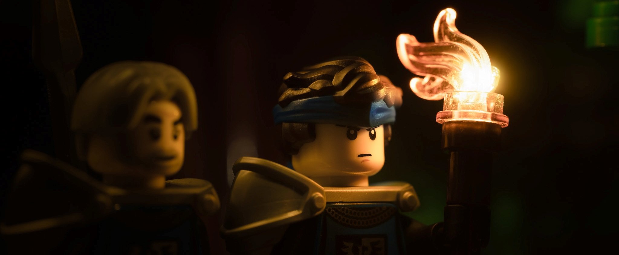 Two LEGOs with torch