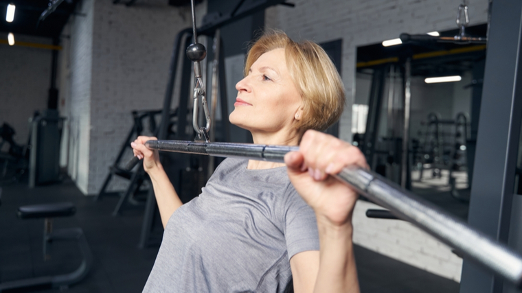 Older woman performing pulldown exercise