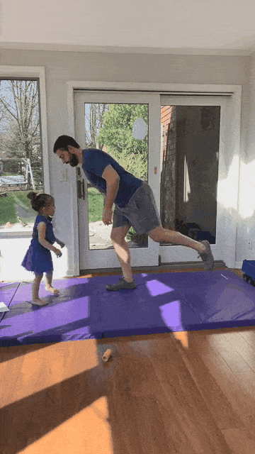 A gif of Matt's kid trying to push him over as he balances on one leg.
