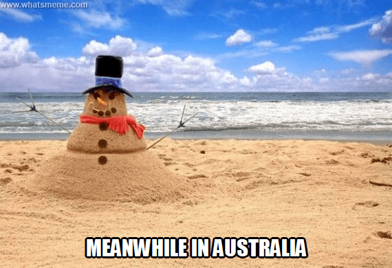 A picture of a sand "Snowman" that says "meanwhile in Australia"