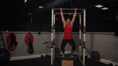 Staci jumping up to do a negative pull-up., a great movement until you can bring regular pull-ups into your circuit.