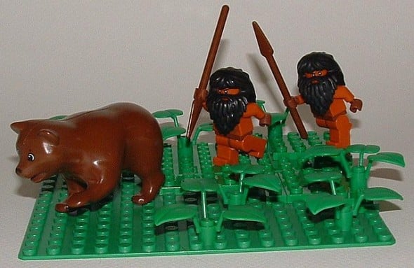Two LEGO Cavemen hunt a bear, paleo style