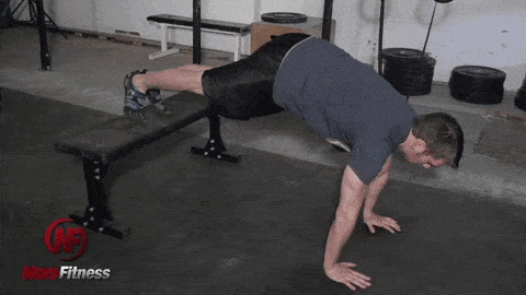 Decline push-ups like this are a great way to progress your bodyweight exercises.