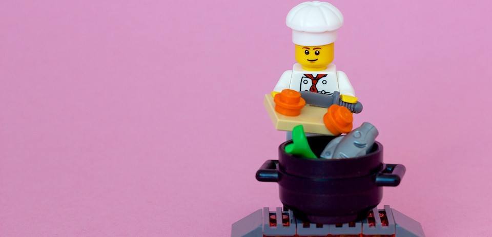 A picture of a LEGO chef using spices